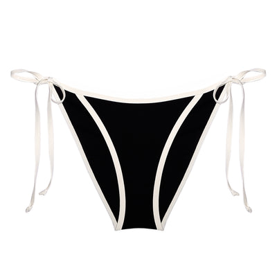 Packshot of the Cora Bikini Tanga. It has classic triangle shape with side ties and a semi-high cut leg, that gives it a timeless. The sporty look with the bold white and black contrast effortlessly channels the iconic 90's aesthetic. 