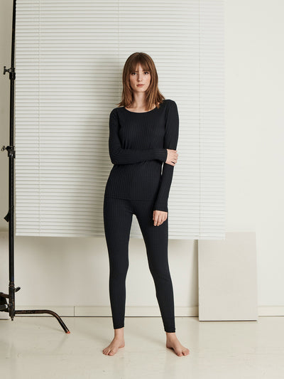 Female wearing our Celine Long Sleeve Top Black. Seen from the front.