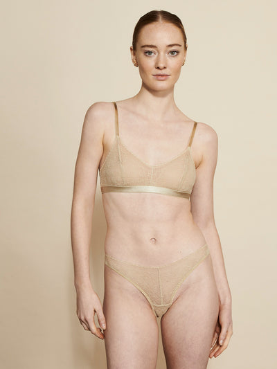 Female wearing our Christy Bra Beige. Seen from the front. 