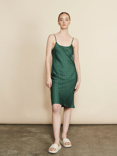 Female wearing our Fie Slip Dress Forest. Seen from the front.